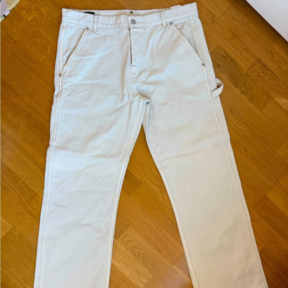 Men’s Fendi off-white denim carpenter jeans.